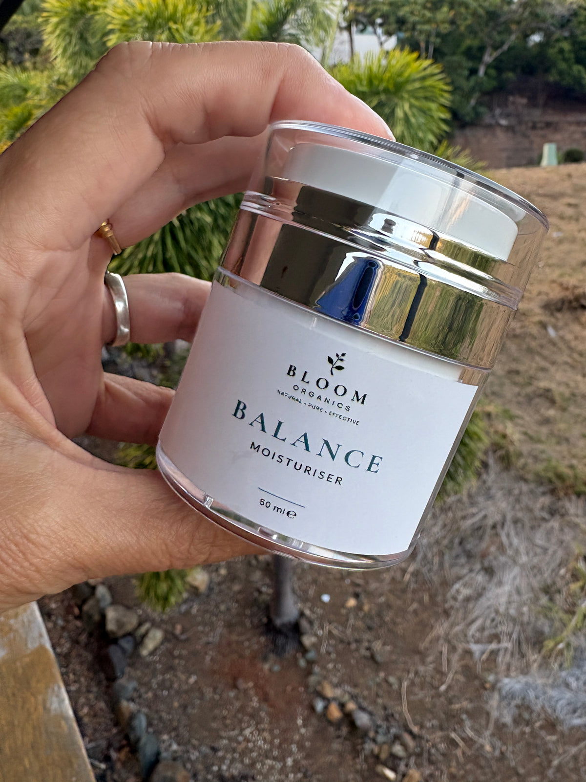 Balance Moisturiser 50 mL held in a hand outdoors
