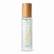 Femme perfume oil 15 mL roll-on with wooden cap on a white background