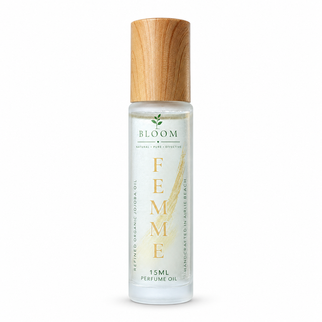 Femme perfume oil 15 mL roll-on with wooden cap on a white background