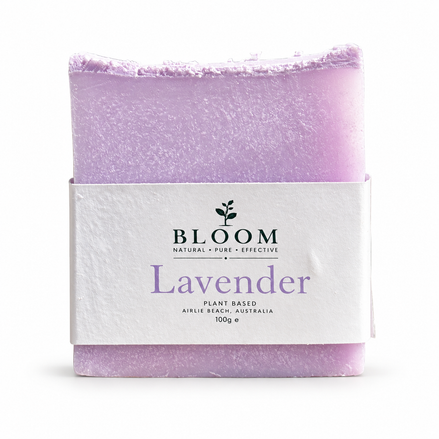 Lavender + Shea Butter soap bar in Bloom Organics packaging on a white background