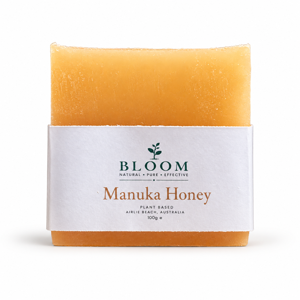 Manuka Honey + Shea Butter soap bar in Bloom Organics packaging on a white background