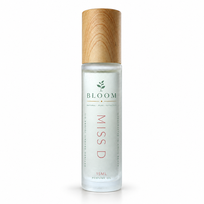 Miss D perfume oil 15 mL roll-on with wooden cap on a white background