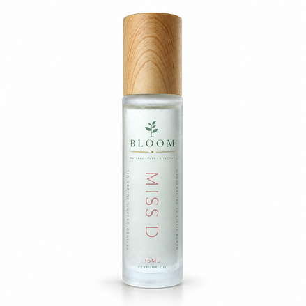 Miss D perfume oil 15 mL roll-on with wooden cap on a white background