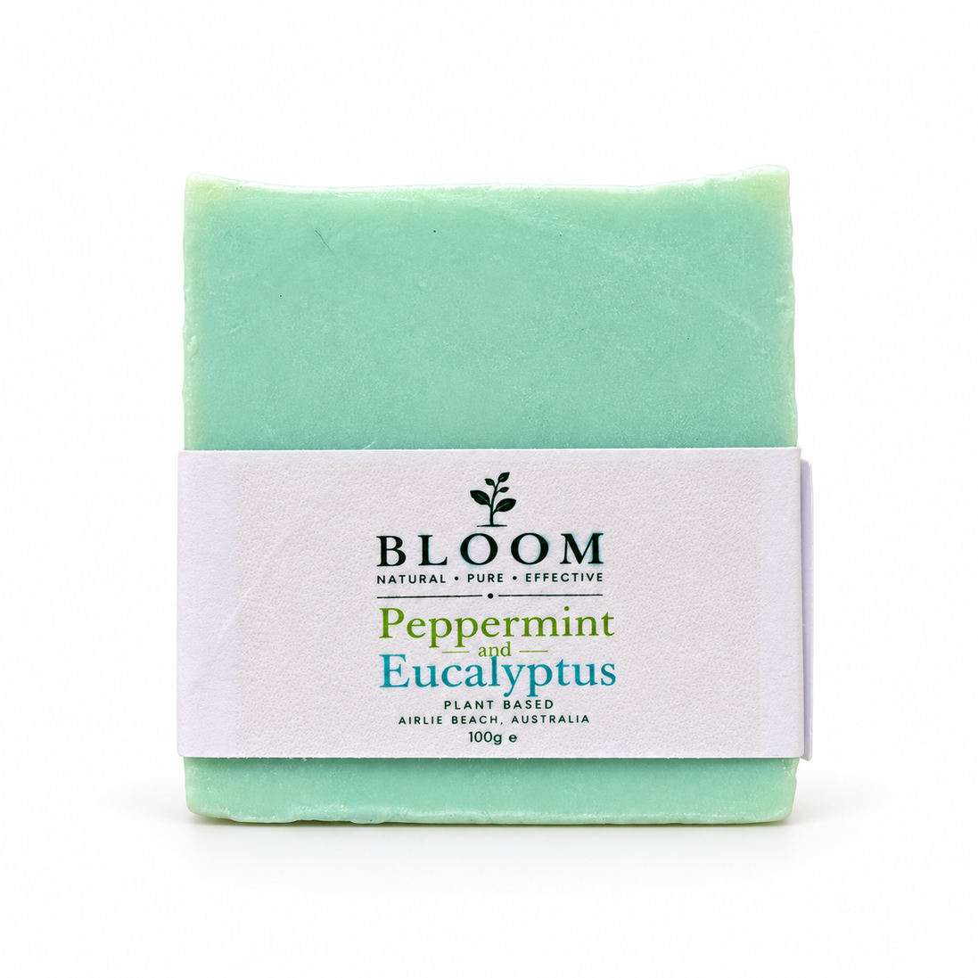 Bloom Peppermint and Eucalyptus plant-based soap, 100 g, with its mint green bar and Airlie Beach label on a white background.