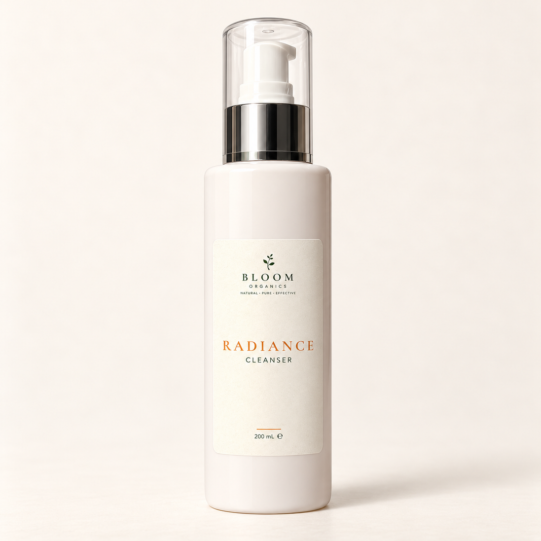 Bloom Organics Radiance Cleanser, 200 mL pump bottle on a warm ivory-white background.