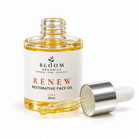 Bloom Renew Restorative Face Oil 30ml with its dropper resting beside the open bottle on a white background
