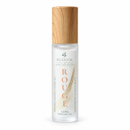 Rouge perfume oil 15 mL roll-on with wooden cap on a white background