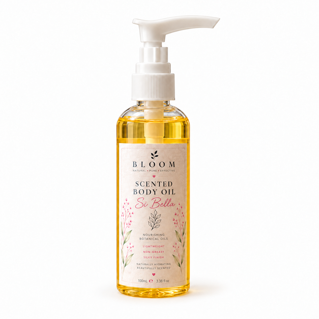 Si Bella scented body oil 100 mL in a clear bottle with white pump and golden oil on a white background