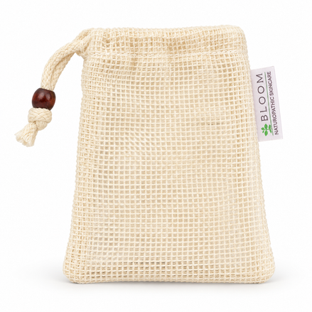 Single Bloom soap saver pouch in cream mesh with drawstring on a white background